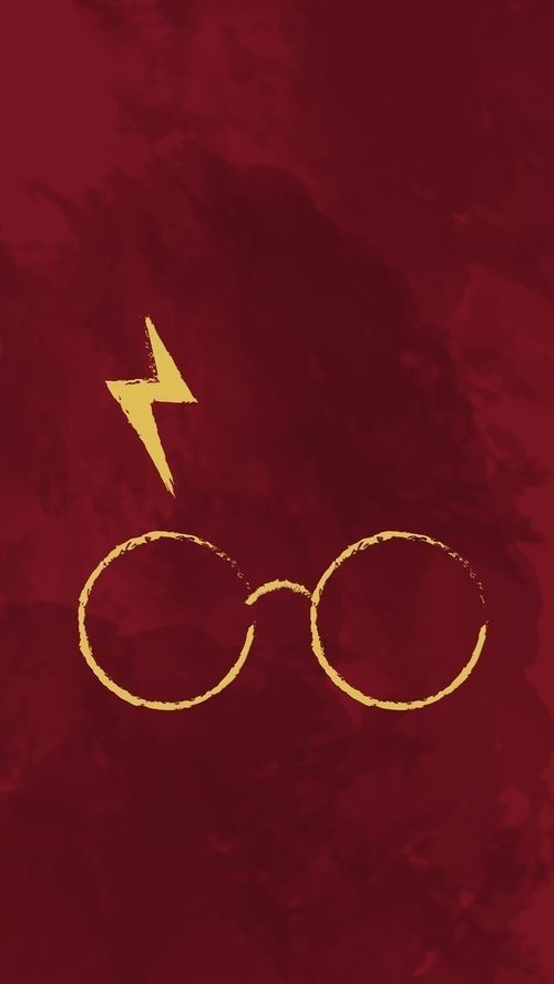 harry potter glasses with lightning bolt drawn on the side in red and gold paint, against a dark background