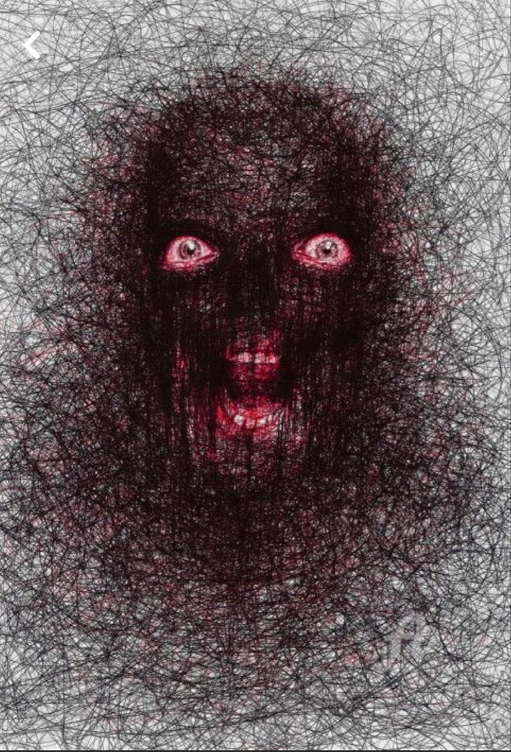 a drawing of a face with red eyes and black hair on the bottom half of it