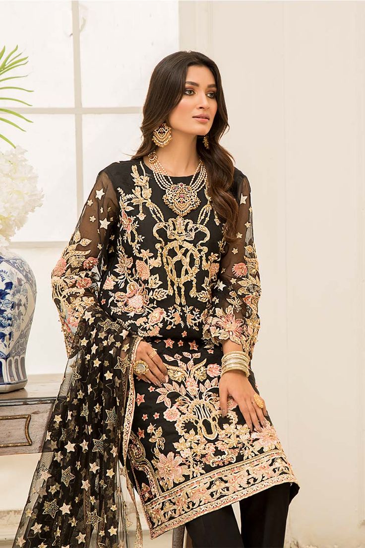 Brand: aroshiProduct Code: BAKHOORCollection: Luxury Formals One of our most traditional designs in this collection, Bakhoor is rendered on an ink-black canvas that boasts of contrasting gold, pink, and light peach embroideries that are meticulously decorated with gold sequins. A traditional, and detailed net dupatta completes this look. It is truly a magnificent ensemble to add to your wardrobe this season. COLOUR: BLACKFABRIC: ORGANZA AND NETSHIRT: EMBROIDERED FRONT AND BACK WITH ADDA WORK AT ORGANZASLEEVES: EMBROIDERY AND ADDA WORK DUPATTA: PASTE ORGANZATROUSER: RAW SILK Aroshi Luxury Formal's Authenticity Guaranteed – 100% Original Brand.3 Days Return Policy T&C apply.International Delivery. Faisal Fabrics Store Online offers the Biggest range of Pakistani original branded designer sui Organza Sleeves, Formal Suit, Chiffon Collection, Organza Dupatta, Net Dupatta, Formal Suits, Light Peach, Gold Sequins, Fabric Stores Online