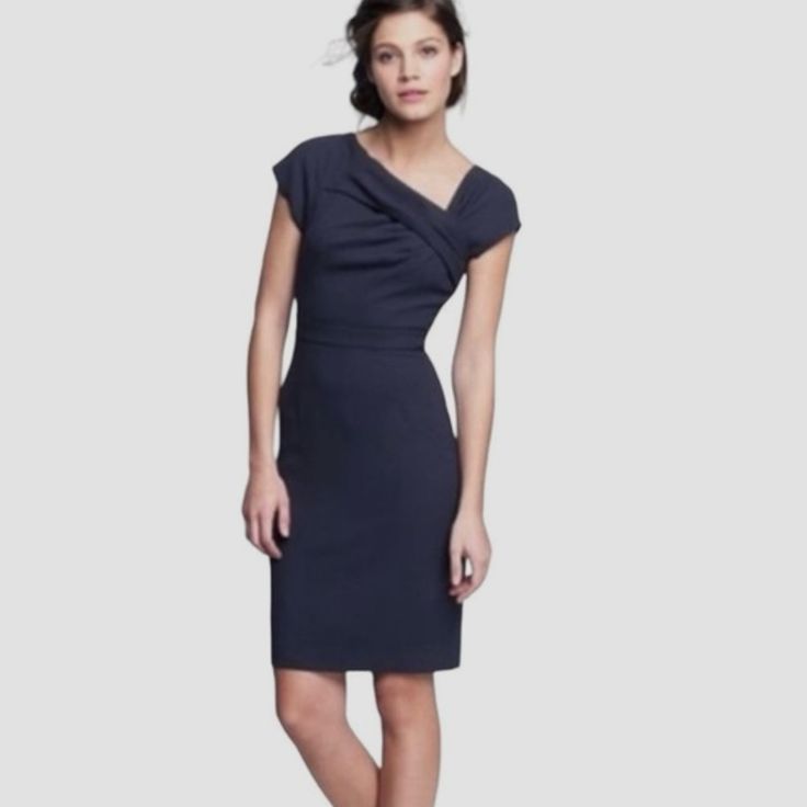 Navy Blue Dress With Side Ruching. Flattering Formal Blue Dress, Blue Dress With Asymmetrical Neckline For Work, Formal Blue Flattering Dress, Flattering Blue Formal Dress, Flattering Blue Evening Dress, Chic Blue Dress With Flattering Silhouette, Blue Asymmetrical Neckline Dress For Work, Affordable Navy Knee-length Dress, Sleeveless Wrap Top