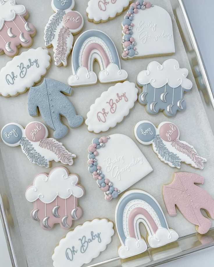 a box filled with lots of decorated cookies