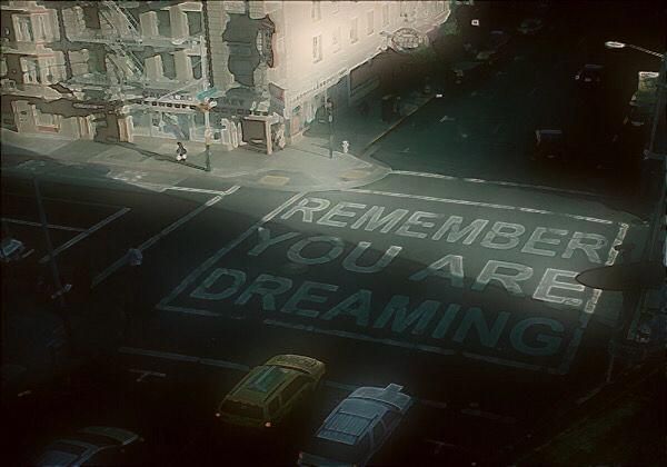 an aerial view of a street sign that says, remember you are dreaming