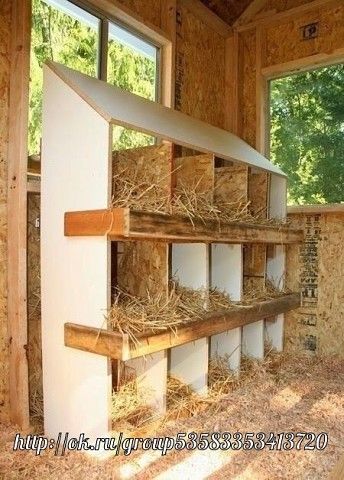 the inside of a barn with hay and straw on shelves in front of large windows