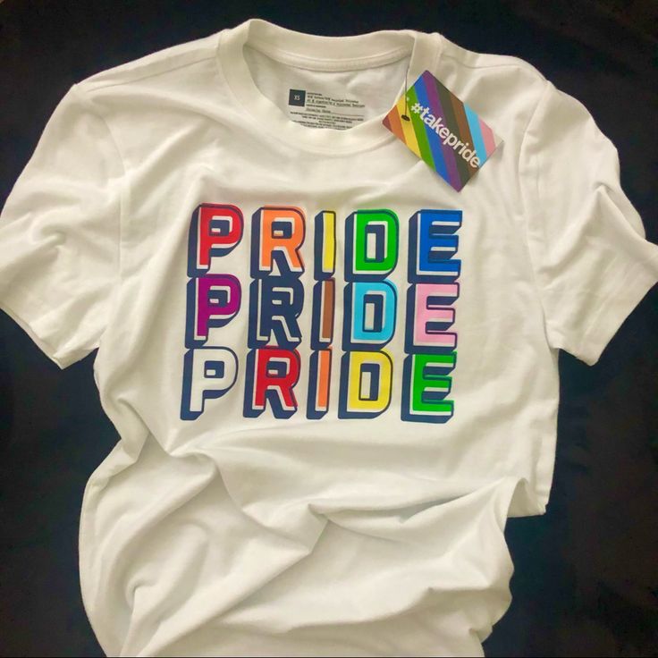 a white t - shirt with the word pride printed on it