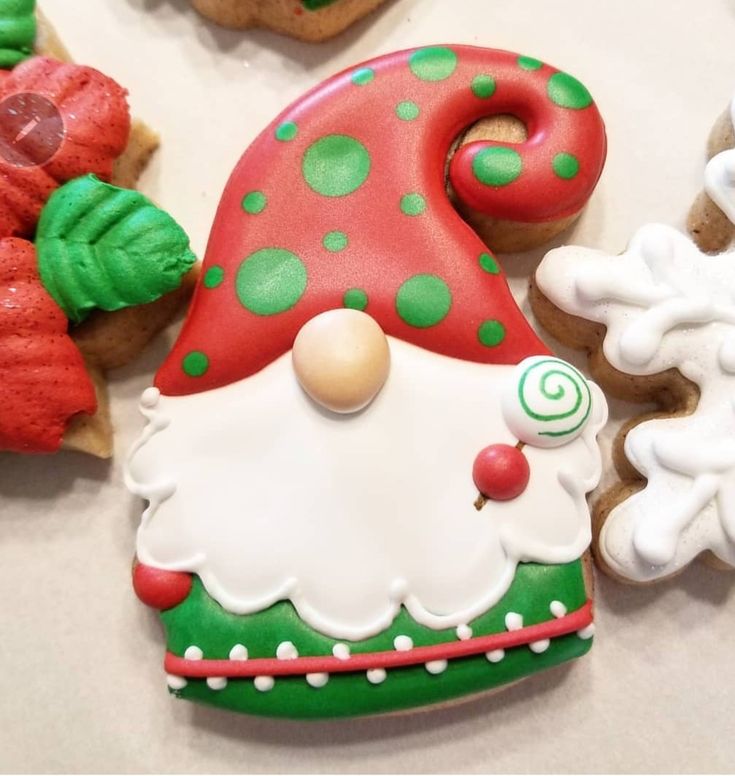 decorated cookies are displayed on a table