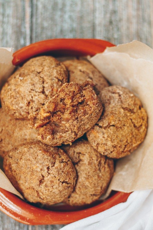 a bowl filled with cookies on top of a wooden table