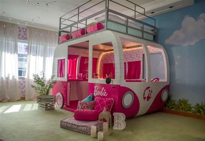 a pink and white bunk bed in a child's room with curtains on the windows