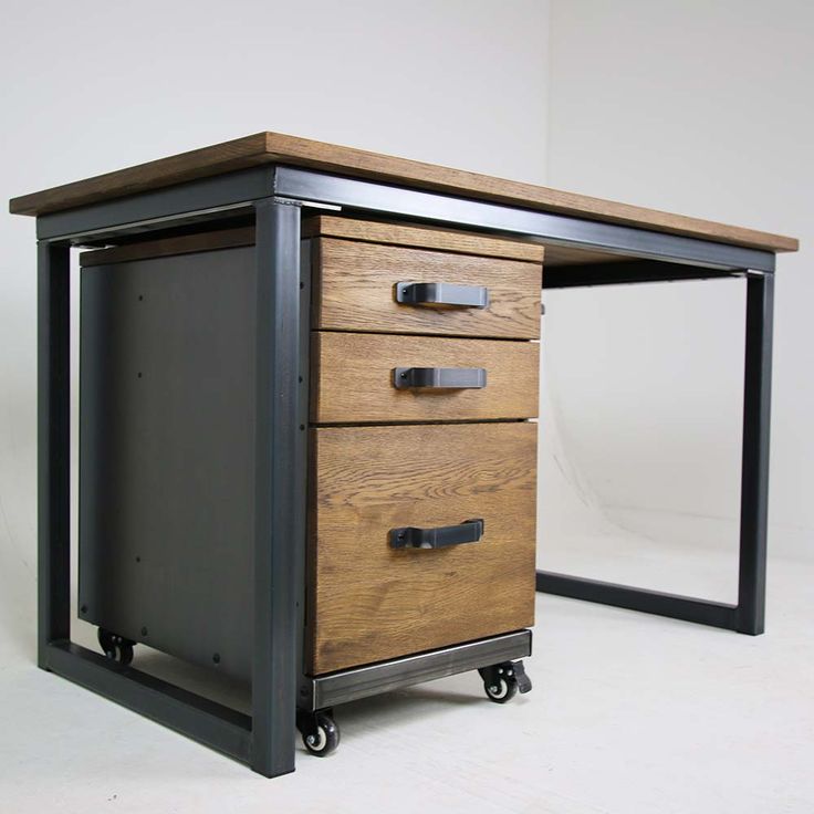 a wooden and metal desk with three drawers on it's wheels, against a white background