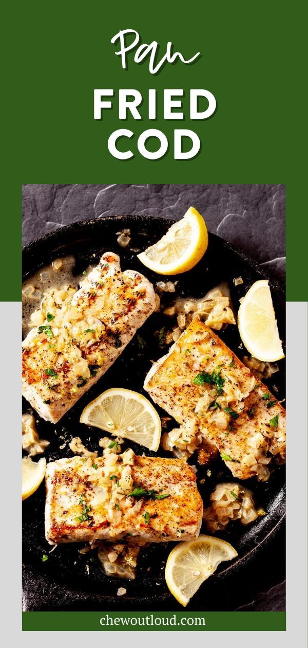 grilled fish with lemons and parmesan on the side in a cast iron skillet