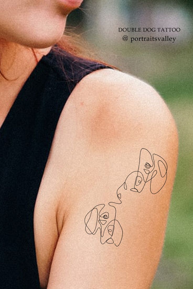 a woman with a dog tattoo on her arm