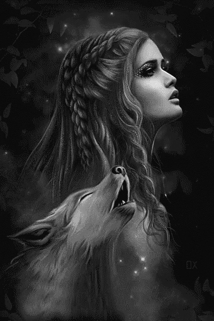 a woman with long hair and a wolf's head on her chest, in the dark