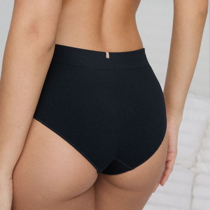 Your go-to bottoms have arrived. Second-skin, seamless modal in a semi cheeky, mid-rise cut. Made with sustainably sourced tencel modal for a balance of soft and stretch, the seamless construction reduces chafing for maximum comfort. Now your bum can bask in soothing seamlessness (because seams don’t belong in the bedroom). Versatile Stretch Modal Bottoms, High Waist Supportive Seamless Bottoms, Supportive Compressive Bottoms With Seamless Construction, Shaping Seamless Solid Bottoms, Supportive Versatile Bottoms, Solid Shapewear Bottoms Bra-friendly, Supportive Stretch Seamless Bottoms, Compressive Seamless Bottoms, Compressive Seamless Elastane Bottoms