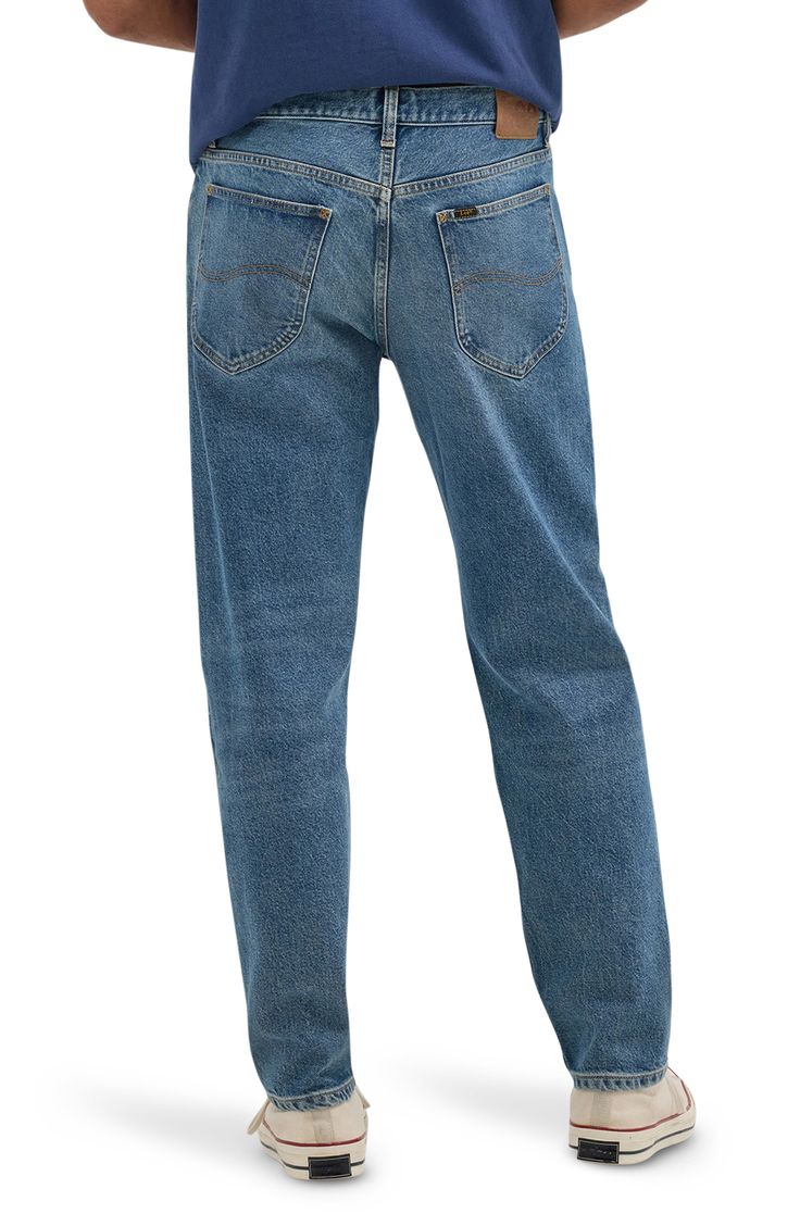 Breathable cotton and silky lyocell bring exceptional comfort to jeans that are cut in a relaxed, casual fit and styled in a wash of perfectly faded blue. Button fly Five-pocket style 67% cotton, 32% lyocell, 1% elastane Machine wash, tumble dry Imported Relaxed Fit Jeans With Button Closure In Medium Wash, Classic Relaxed Fit Washed Blue Jeans, Medium Wash Relaxed Fit Jeans With Button Closure, Classic Jeans In Medium Wash, Relaxed Fit Medium Wash Jeans With Button Closure, Classic Relaxed Fit Jeans With Button Closure, Classic Light Wash Jeans With Button Closure, Rugged Relaxed Fit Medium Wash Jeans, Lee Relaxed Fit Jeans