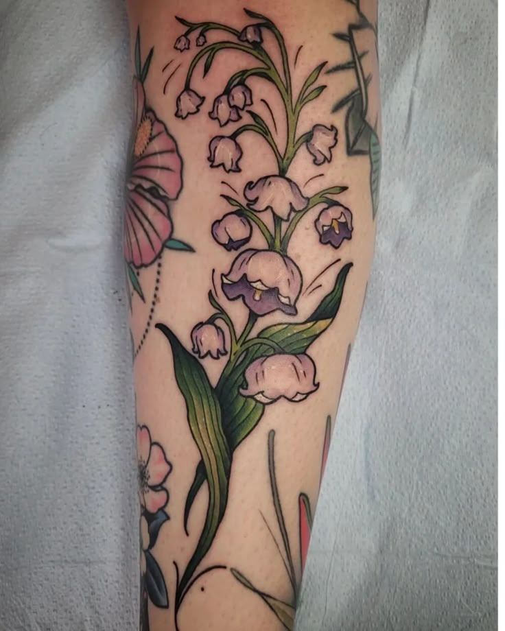 a woman's leg with flowers on it