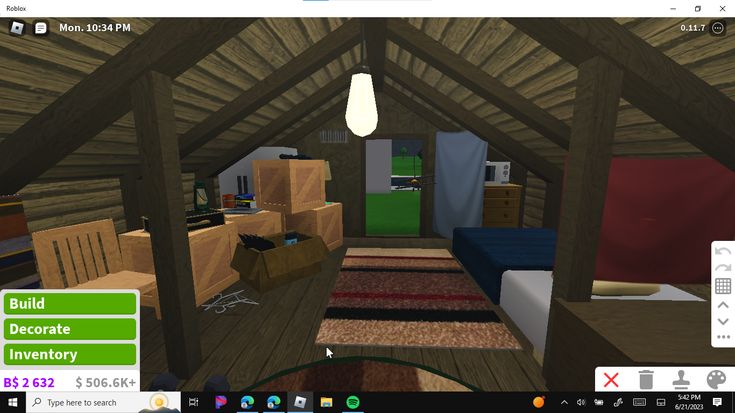 a computer screen shot of a room with furniture and boxes on the floor in it