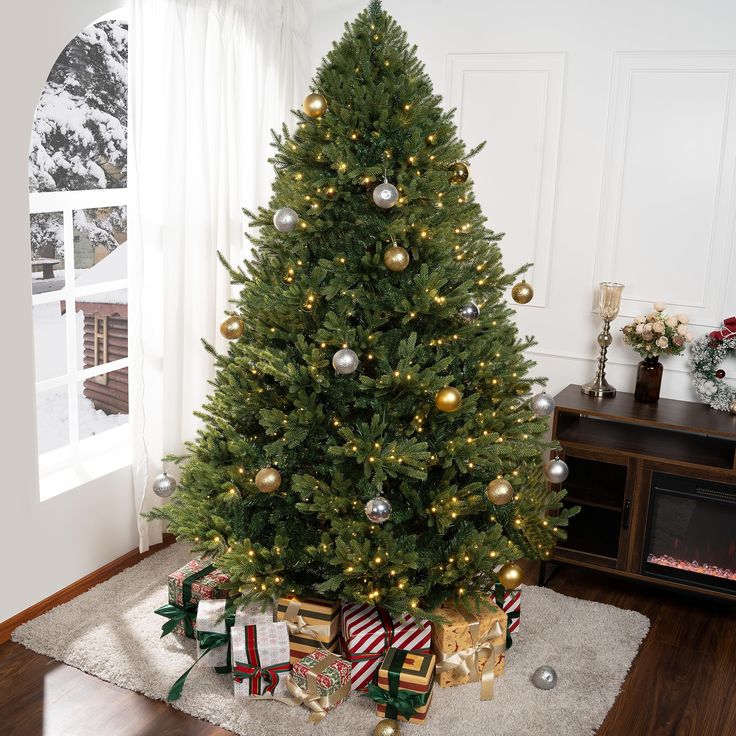 a decorated christmas tree with presents under it