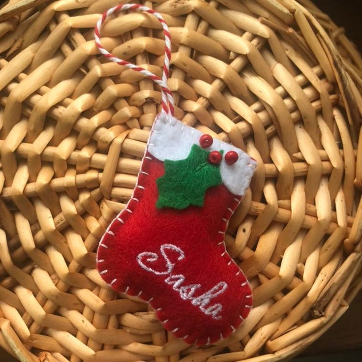 a christmas stocking hanging from a wicker basket