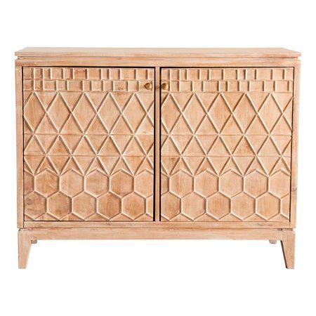 a wooden cabinet with geometric designs on the doors