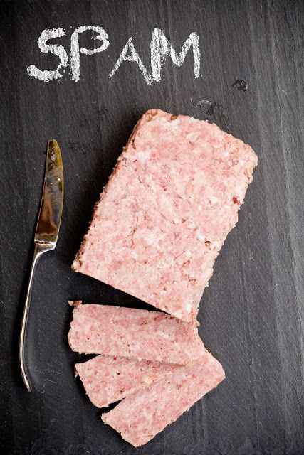 a piece of meat next to a knife and fork on a slate board with the word map written in white chalk