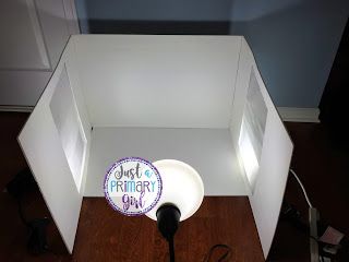 an overhead view of a white box with a microphone in it and a sign that says just birthday girl