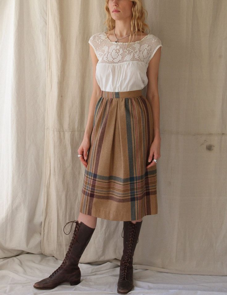 "Sweet 70s high waisted union made skirt. Wool with a slick lining inside. Very flattering pleats and a zipper and button closure. In brand new vintage condition. Best fits size XS - shown on an XS 5'8\" body. Vintage size 5/6. Measurements flat Waist 12\" Length 28\" Hips ~20\"" Retro High Waist Pleated Skirt For Spring, Retro High-waist Pleated Skirt For Spring, High Waist Retro Pleated Skirt For Spring, Retro A-line Workwear Bottoms, Vintage Fitted Flared Pleated Skirt, Retro Pleated Brown Skirt, Retro High Waist Skirt For Work, High Waist Retro Pleated Skirt, Retro Fitted Cotton Pleated Skirt