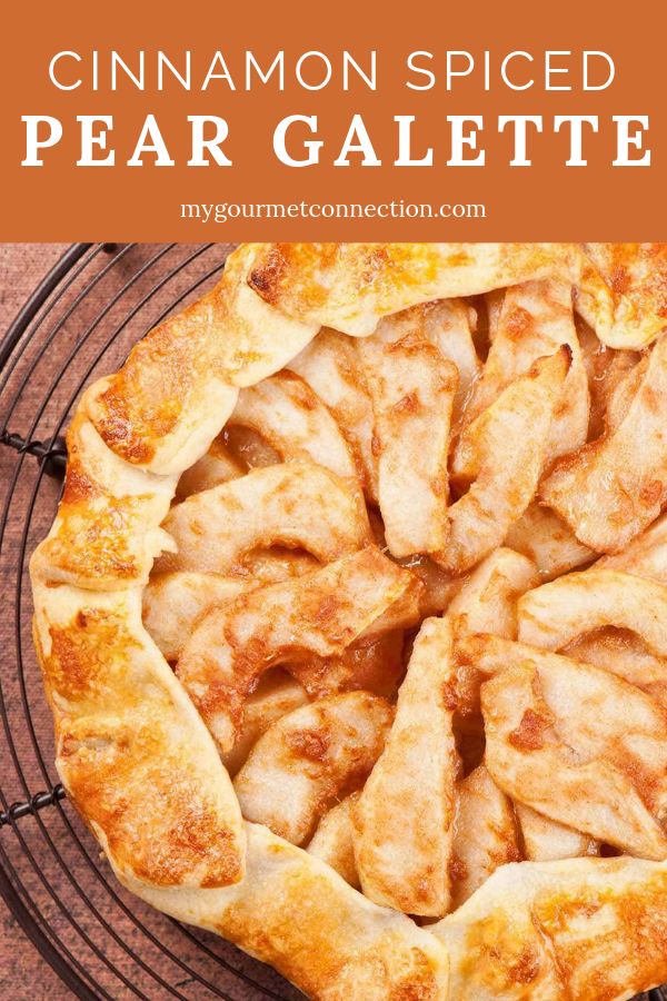 cinnamon spiced pear galette on a cooling rack with text overlay that reads, cinnamon spiced pear gelette