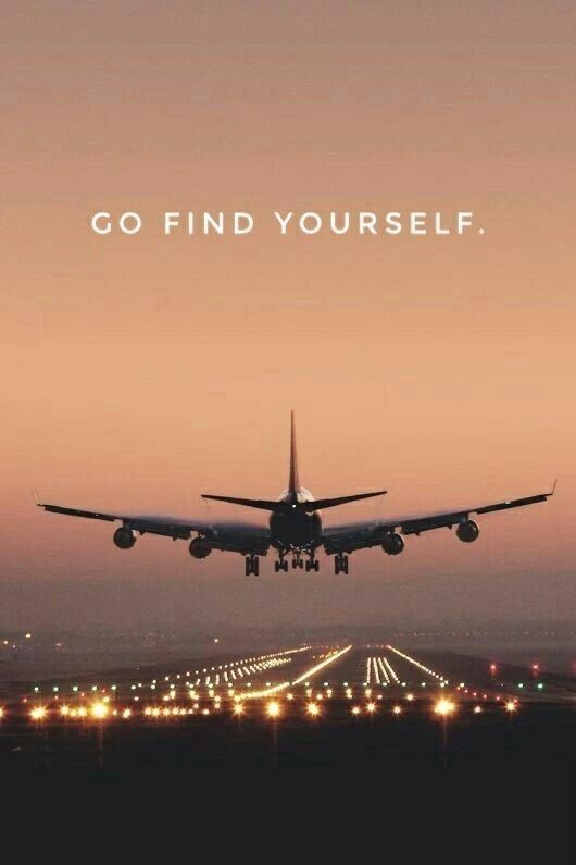 an airplane is taking off from the runway at night with words that read, go find yourself