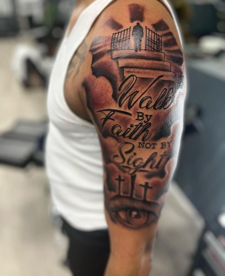 a man with a tattoo on his arm that says walk by faith not by sight