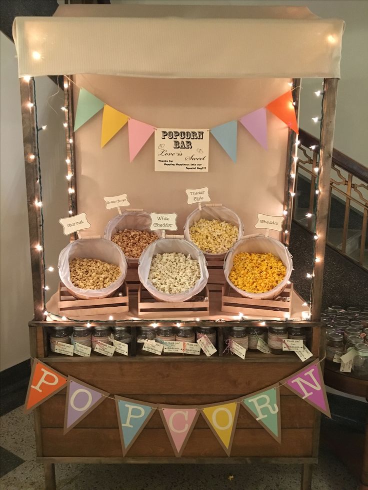 the food stand is decorated with bunting and lights