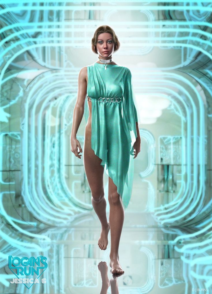 a woman in a green dress walking down a runway