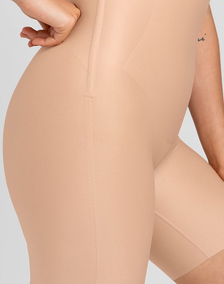 This invisible sculpting, high compression short features minimal seaming with strategically placed hidden sculpting panels for a truly seamless fit. Flexible boning hidden in the side seams prevents roll-down. An opening in the gusset makes bathroom trips a breeze. Honeylove, No-Show High-Waist Shorts for Women in Sand (Nude), Size: XS Sculpting Seamless Short-length Bottoms, Sculpting Smoothing Bottoms Mid-thigh Length, Sculpting Seamless Mid-thigh Bottoms, Sculpting Seamless Mid-thigh Length Bottoms, Sculpting Smoothing Mid-thigh Bottoms, Solid Compressive Full Coverage Shorts, Sculpting Shapewear Bottoms Short Length, Fitted Shorts With Built-in Padding, Compressive Beige Shapewear Mid-thigh Length