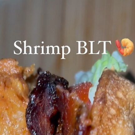 a close up of food on a plate with the words shrimp blt above it