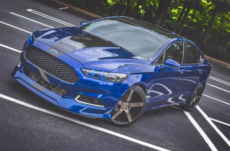 a blue car parked in a parking lot