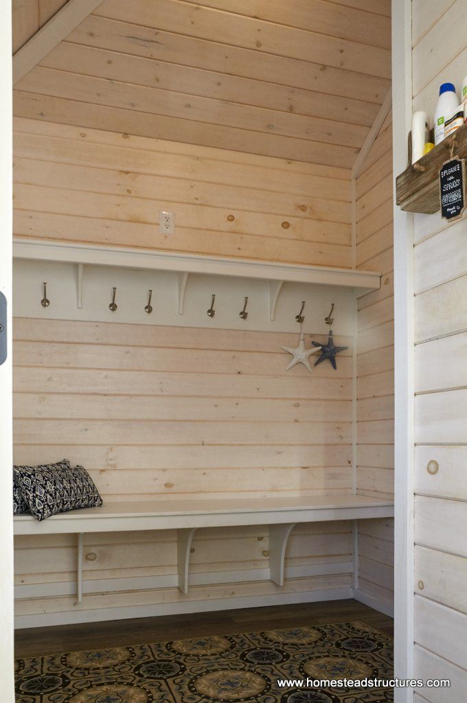 the inside of a wooden room with white walls