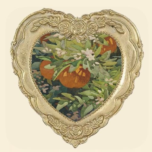 an ornate gold heart shaped frame with oranges and flowers