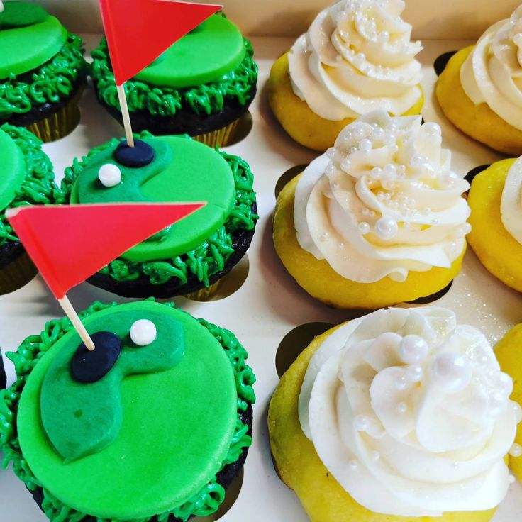 cupcakes decorated with green frosting and golf decorations