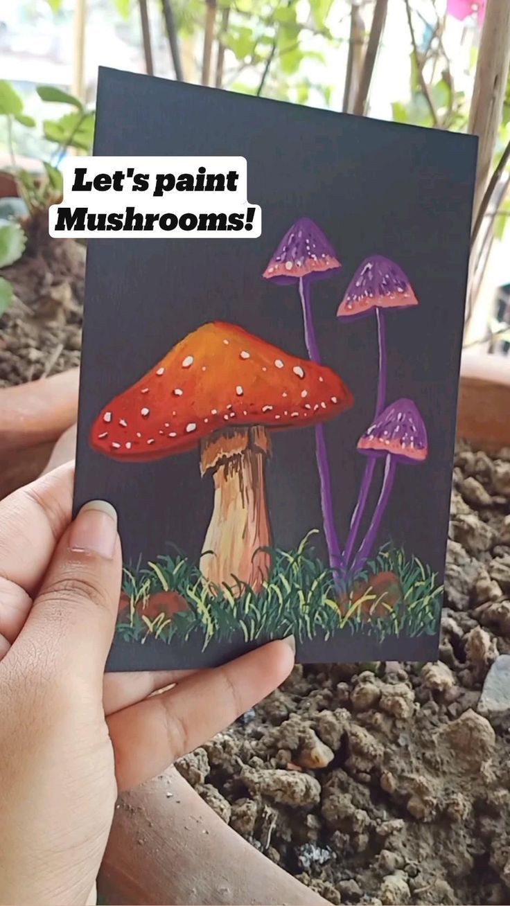 a person holding up a card with mushrooms on it