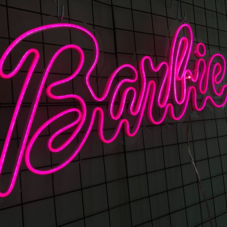 a neon sign that says barbiekie on it's side wall in front of a tiled wall