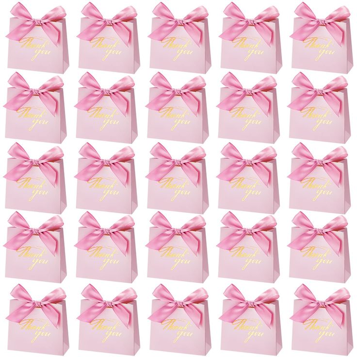 twelve pink gift bags with gold foil lettering and large bows on the top, all tied together