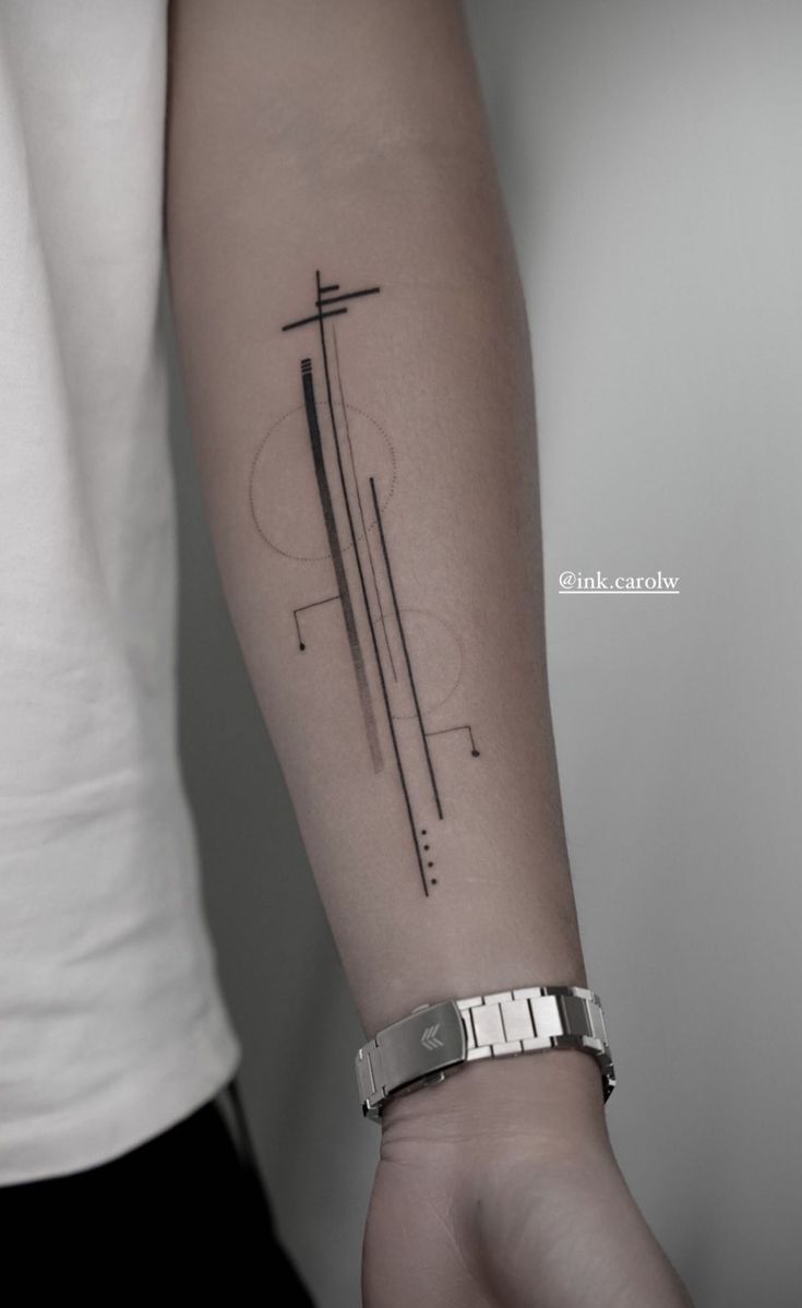 a person's arm with a cross tattoo on the left side of their arm