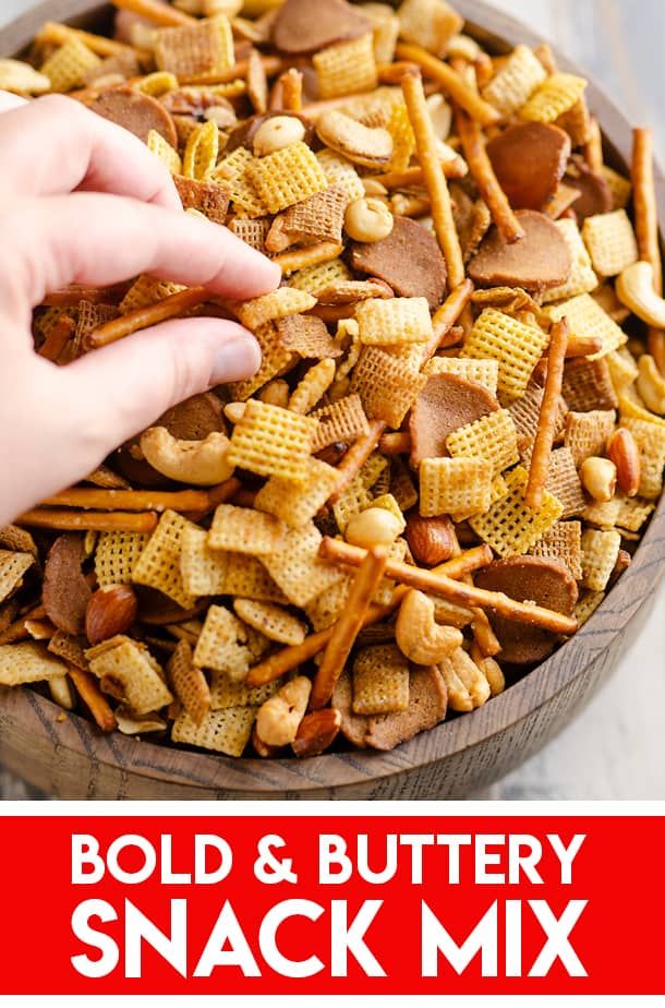 a bowl full of homemade snack mix with the words bold & buttery snack mix