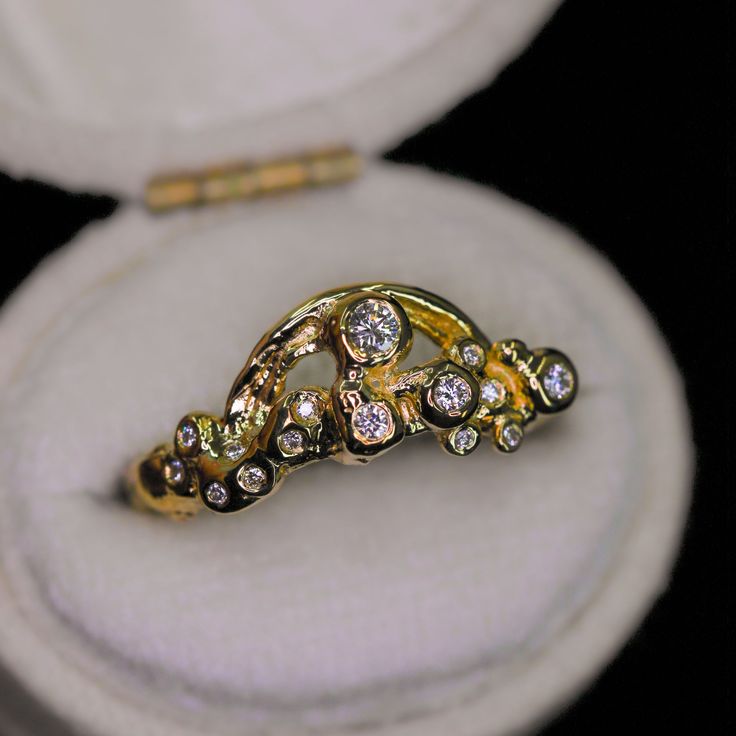 This sparkly ring design is our new Rainbow & Cloud ring (but the largest diamond represents the "sun") in 14K gold and encrusted with diamonds. This piece is imbued with sunshine and joy. A rainbow and sparkling diamonds are set into bubbly "clouds", an abstract representation of sunshine and joy after the rain. Nicole created this ring with different methods of ancient goldsmithing and fusing and then created a mold so that we can recreate this in different 14K gold colors. It is truly a spiri Gold Platinum Jewelry With Single Cut Diamonds, Heirloom Style Rings With Diamond Accents And White Topaz, Heirloom Rings With Diamond Accents And White Topaz, Dazzling 14k Gold Halo Ring, Platinum Jewelry With Gold Single Cut Diamonds, Platinum Jewelry With Single Cut Diamonds In Gold, Exquisite 14k Gold Wedding Ring With Single Cut Diamonds, Heirloom White Topaz Ring With Diamond Accents, Heirloom Style White Topaz Ring With Diamond Accents