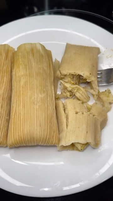 some food on a white plate with a fork