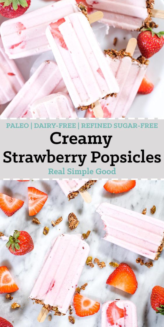 strawberry ice cream popsicles with strawberries on top