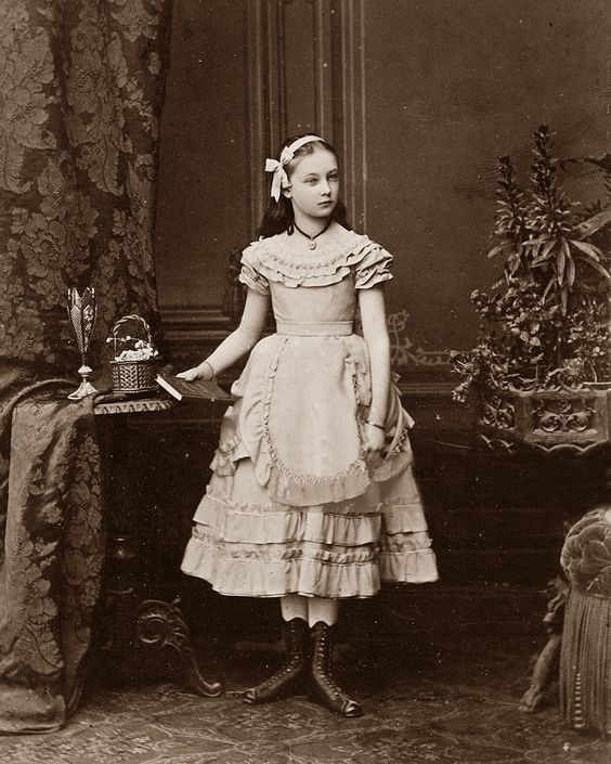 A feast for your eyes: beautiful photographs of little girls in Victorian and Edwardian era holding their dolls, flowers – pressed and alive, paintings by Stephen Mackey, and pretty mid 19th … Victorian Photography, 1870s Fashion, Vintage Children Photos, Victorian Portraits, Victorian Times, 1800s Fashion, Victorian Photos, 19th Century Fashion, Victorian Clothing