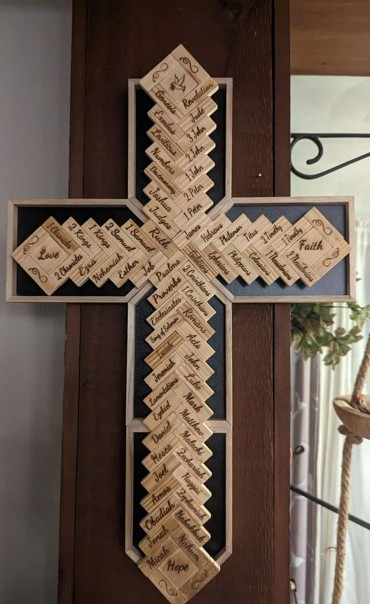 a cross made out of wood with words on it