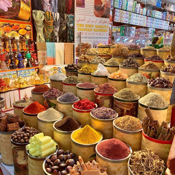 many bowls filled with different types of spices