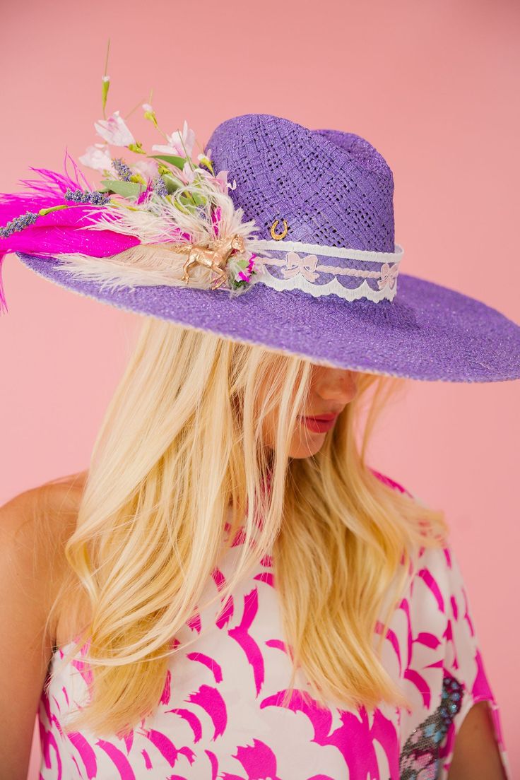 Add a pop of color with our Purple Haze sun hat. The playful ribbon band, adorned with white and pink feathers and pink flowers, will make you feel like a Derby winner. Keep the sun out of your eyes and your style on point with this quirky hat. This hat is ONE OF A KIND, created by our owner Stephanie. To receive item quicker, expedited shipping is available at checkout. Derby Winners, Suns Out, Pink Feathers, Sun Hat, Sun Hats, Your Eyes, Make You Feel, Pink Flowers, Derby