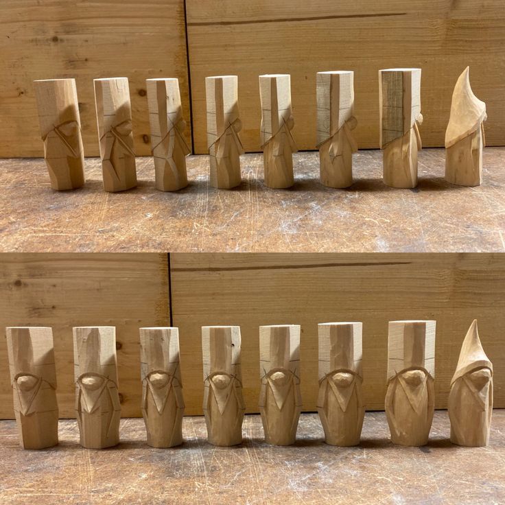 several pieces of wood carved to look like people are standing in front of each other