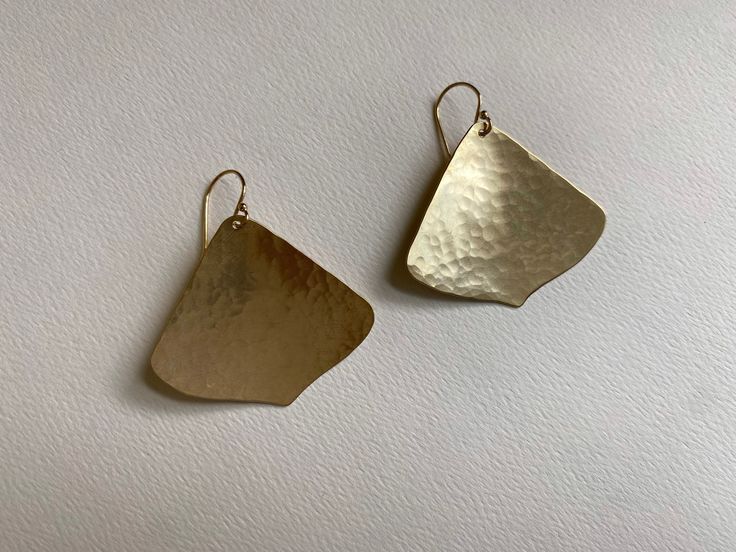 Brass Gingko Leaf Earrings, Petal Shaped Jewelry I hammer and forge these earrings by hand. They are softly textured by hammer marks and have an organic texture and shape.  These brass gingko shaped leaves dangle from 14k gold-fill hooks. Your pair may be slightly different than those shown do to their unique handmade nature. They are about 1 & 1/2 inches long including the hooks, and 1 & 3/8 inch wide. Brass is uncoated and natural so it will oxidize over time to a darker bronze color. I will i Artisan Yellow Gold Hammered Earrings, Artisan Hammered Yellow Gold Earrings, Formal Hammered Brass Earrings, Bronze Hammered Earrings For Gift, Gingko Leaves, Green Box, Branch Design, Leaf Earrings, Color Card